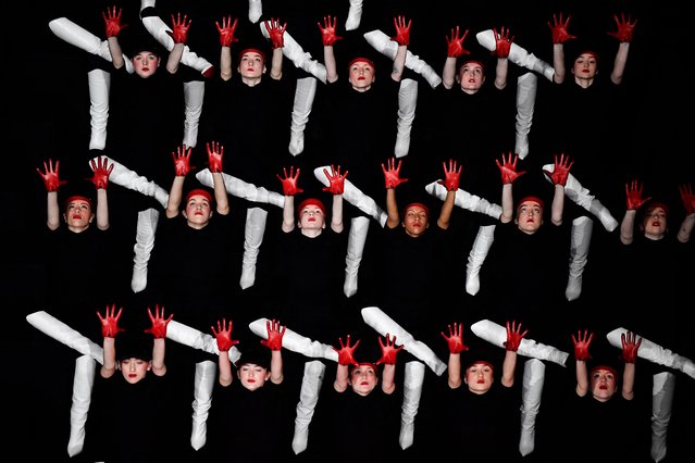 Dancers, wearing Louboutin shoes, perform on the sidelines of the Paris Fashion Week at the Opera Comique in Paris, on March 2, 2023. (Photo by Julien de Rosa/AFP Photo)