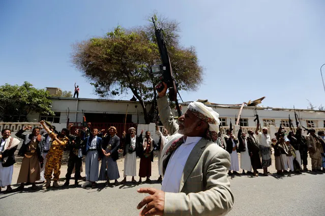 Tribesmen loyal to the Houthi movement raise up their rifles during a gathering to show support to the movement in Sanaa, Yemen, May 19, 2016. (Photo by Khaled Abdullah/Reuters)