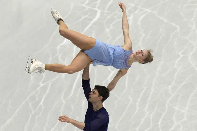 Minerva Fabienne Hase and Nolan Seegert, of Germany, perform in the pairs free program at the Figure Skating World Championships in Montpellier, south of France, Thursday, March 24, 2022. (Photo by Francisco Seco/AP Photo)