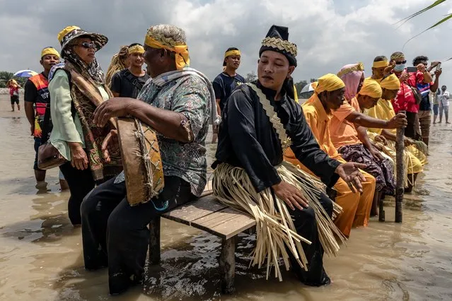 Members of Mah Meri tribe performs the Puja Pantai ritual, a thanksgiving ritual praying to the spirits of the seas in Pulau Carey, Selangor, Malaysia on February 5, 2022. The Mah Meri tribe, who are descendants of seafaring people who lived off the sea through fishing and trading, celebrate their new year according to the lunar calendar, by making offerings to the sea. (Photo by Mohd Daud/ZUMA Press Wire Service/Rex Features/Shutterstock)