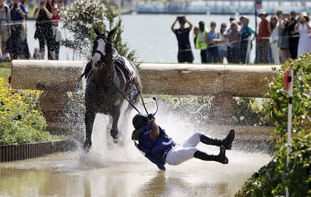 Ronald Zabala-Goetschel of Ecuador falls off his horse Forever Young Wundermaske during the Eventing Cross Country Team and Individual competition of the Equestrian Eventing competitions in the Paris 2024 Olympic Games, at the Chateau de Versailles in Versaille, France, 28 July 2024. (Photo by Tolga Akmen/EPA)