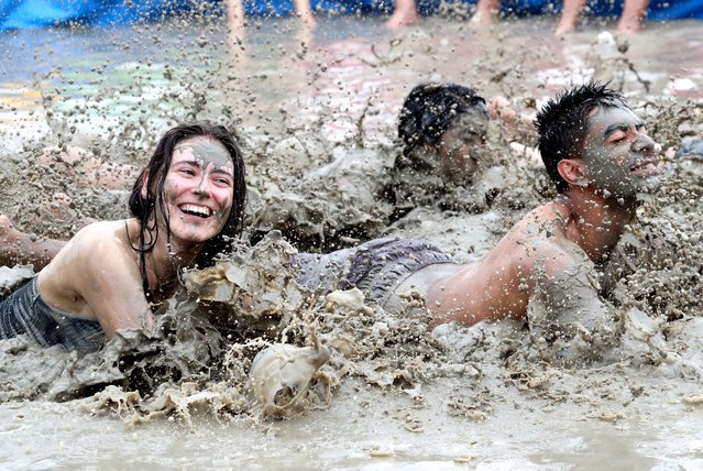 Foreign tourists who visited the “Boryeong Mud Festival” venue in Boryeong-si, Chungcheongnam-do on the July 19th, 2024 are having fun rolling around in a mud bath. The 27th Boryeong Mud Festival this year will be held until the 4th of next month. Last year, more than 1.6 million tourists visited the festival. (Phoot by Shin Hyeon-jong)