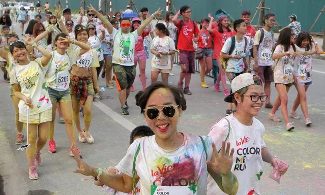 Participants take part at the “Color Me Run” festival in Hanoi, Vietnam, May 28, 2016. (Photo by Nguyen Thanh Cao/Reuters)