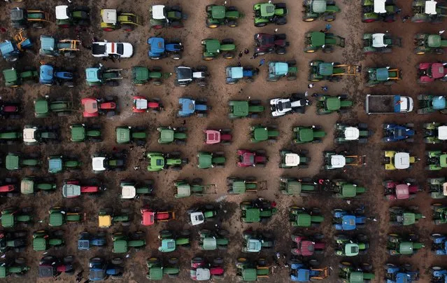 In this aerial photo farmers' tractors gather during a demonstration to demand fairer prices for their produce on March 3, 2022 in Antequera, Spain. (Photo by Jorge Guerrero/AFP Photo)