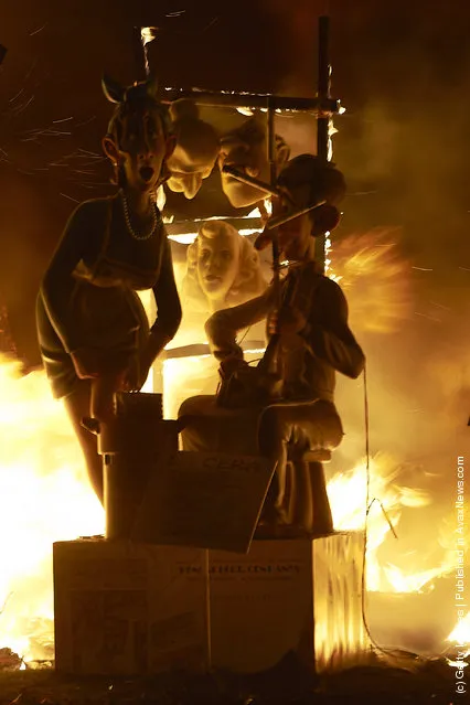 Combustible 'Ninot' caricatures burn during the last day of the 'Fallas' festival on March 19, 2012 in Valencia, Spain