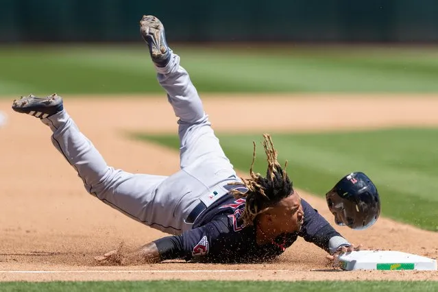 Cleveland Guardians third baseman Jose Ramirez (11) slides into third base during the fourth inning against the Oakland Athletics at RingCentral Coliseum in Oakland, California on May 1, 2022. (Photo by Stan Szeto/USA TODAY Sports)