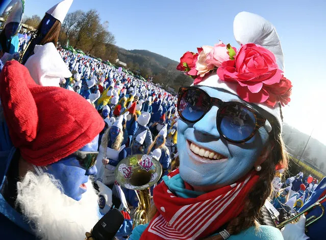At a world record for the largest smurf meeting in the world, a participant dressed as a smurf looks into the photographer's camera in Baden-Wuerttemberg, Lauchringen, Germany on February 16, 2019. A new world record was set at the meeting with 2762 participants. The previous record of 2510 set in Wales in 2009 was thus surpassed. (Photo by Uli Deck/dpa/Picture Alliance via Getty Images)