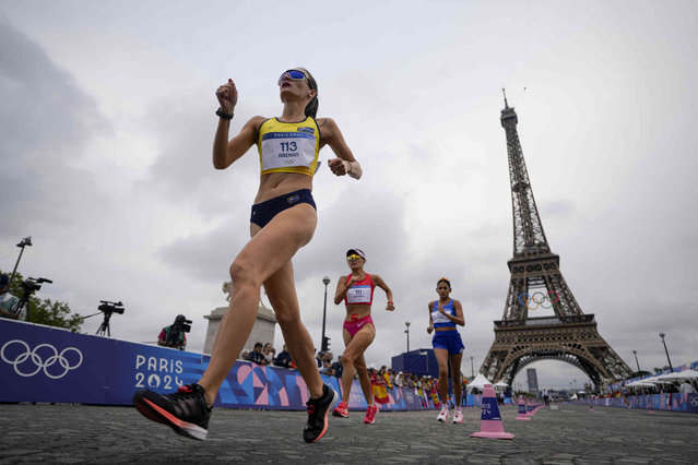 Columbia's Lorena Arenas (113), China's Qieyang Shijie (111) and Hungary's Rita Recsei (133) compete during the marathon race walk relay mixed at the 2024 Summer Olympics, Wednesday, August 7, 2024, in Paris, France. (Photo by Vadim Ghirda/AP Photo)