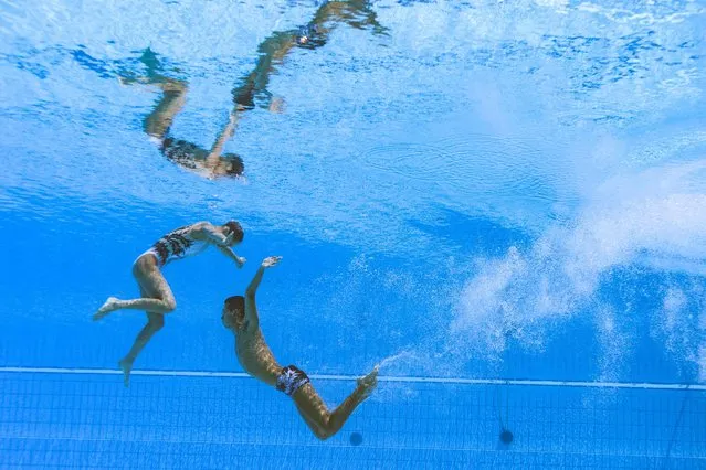 China's Shi Haoyu and China's Zhang Yiyao competes to take bronze in the mixed duet free artistic swimming finals during the Budapest 2022 World Aquatics Championships at the Alfred Hajos Swimming Complex in Budapest on June 25, 2022. (Photo by François-Xavier Marit/AFP Photo)