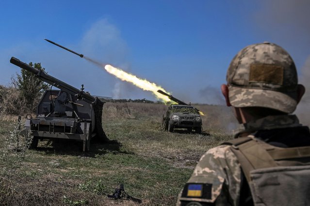 Ukrainian servicemen fire small multiple launch rocket systems towards Russian troops, amid Russia's attack on Ukraine, near a front line in Zaporizhzhia region, Ukraine on August 19, 2023. (Photo by Viacheslav Ratynskyi/Reuters)