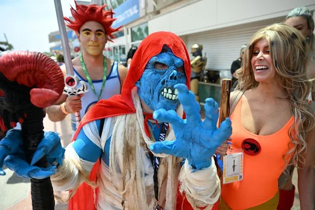 Cosplayers portraying Thundercats characters attend Comic-Con International in San Diego, California, on July 23, 2022. (Photo by Robyn Beck/AFP Photo)