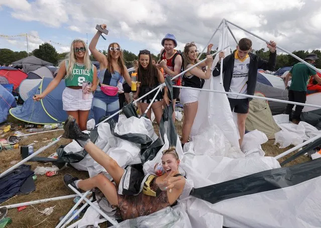 Friends from Dublin make it through the inclement weather in the  Jimmy Hendrix campsite on the 3rd and final day of music at the Electric Picnic in Stradbally, Co Laois, Ireland on September 4, 2022  (Photo by Alan Betson/The Irish Times)