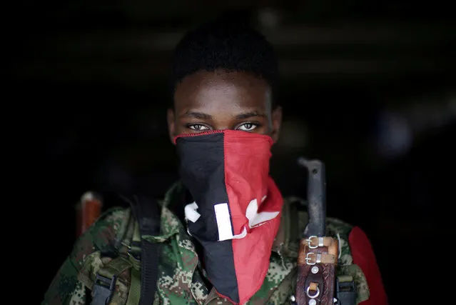 A rebel from Colombia's Marxist National Liberation Army (ELN) poses for a photograph in the northwestern jungles, in Colombia, August 31, 2017. (Photo by Federico Rios/Reuters)