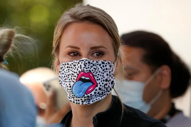 A nurse at St. Joseph's Hospital wears a unique mask as the hospital celebrates the release of a COVID-19 patient after 45 days in their care during the outbreak of the coronavirus disease (COVID-19) in Orange, California, U.S., May 5, 2020. (Photo by Mike Blake/Reuters)