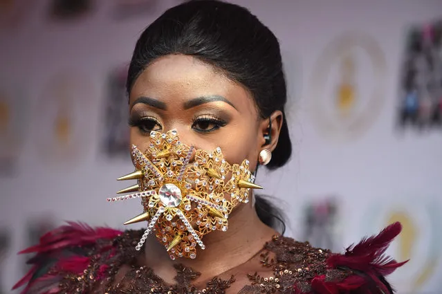 Ghanaian model Nana Akua Addo poses on the red carpet during the All Africa Music Awards in Lagos on November 12, 2017. (Photo by Pius Utomi Ekpei/AFP Photo)