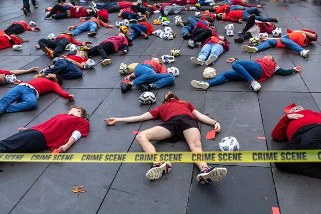Members of the French environmental activists named “Red Card to Qatar” perform a die-in at Republic square in Paris, France, 20 November 2022. The 'Red Card to Qatar' campaign calls for a boycott of the 2022 World Cup on environmental and human rights grounds. (Photo by Christophe Petit Tesson/EPA/EFE/Rex Features/Shutterstock)