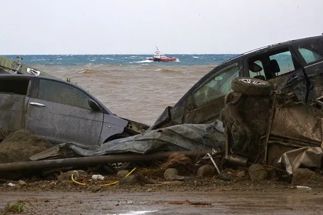 Damaged cars are seen in the sea in the southern Ischia island on November 26, 2022, following heavy rains that sparked a landslide. Italy's interior minister said there had been no confirmed deaths in a landslide on November 26, 2022 on the island of Ischia, despite earlier reports of eight killed.. (Photo by ANSA via AFP Photo)