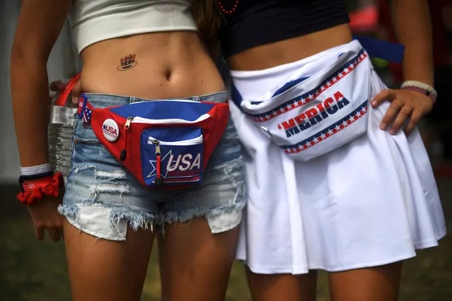 (L) Anna Lena O'Reilly, 18, and Allison Durphee, 18, wear patriotic themed fanny packs during the fifth annual Made in America Music Festival in Philadelphia, Pennsylvania September 3, 2016. (Photo by Mark Makela/Reuters)