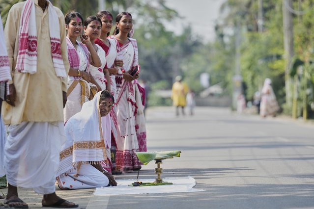 Villagers wait to welcome a village king during the Gohain Uliuwa Mela festival in Mayong village on the outskirts of Guwahati, India, Saturday, April 19, 2025. (Photo by Anupam Nath/AP Photo)
