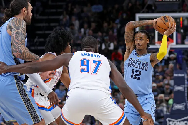 Ja Morant #12 of the Memphis Grizzlies looks to pass during the second half against the Oklahoma City Thunder at FedExForum on December 07, 2022 in Memphis, Tennessee. (Photo by Justin Ford/Getty Images)