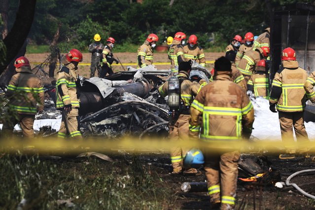 Rescuers work at the site of a military plane crash in Pohang, South Korea, May 29, 2025. All four crew members were killed in South Korea's military plane crash, local newspaper Chosun Ilbo said Thursday The P-3 maritime patrol aircraft with four crew members aboard took off from a military base in the southeastern city of Pohang for training at about 1:43 p.m. local time (0443 GMT), according to the defense ministry The patrol plane crashed into a hill near the base around 1:49 p.m. local time (0449 GMT) and no civilian casualties had yet to be identified, the ministry noted. (Photo by Xinhua News Agency)