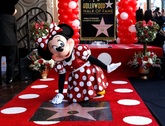 The character of Minnie Mouse poses on her star after it was unveiled on the Hollywood Walk of Fame in Los Angeles, California, January 22, 2018. (Photo by Mario Anzuoni/Reuters)