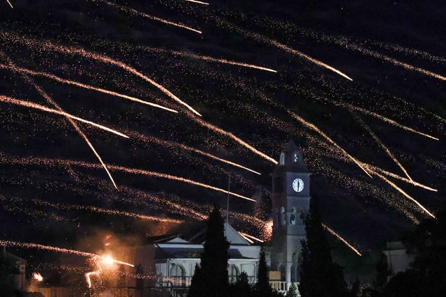 Handmade rockets fly over Panagia Erithiani church during Greek Orthodox Easter celebrations in the village of Vrontados, on the island of Chios, Greece, on April 19, 2025. (Photo by Konstantinos Anagnostou/Reuters)