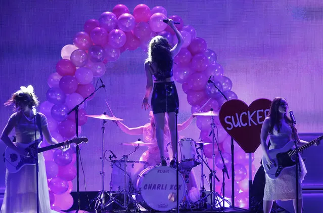 Charli XCX performs a medley of songs during the 42nd American Music Awards in Los Angeles. (Photo by Mario Anzuoni/Reuters)