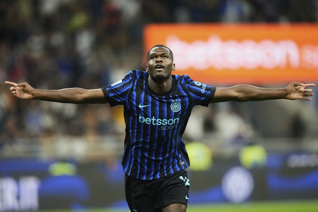 Inter Milan's Ange Yoan Bonny celebrates scoring his side's 5th goal during a Serie A soccer match between Inter Milan and Torino, at the San Siro stadium in Milan, Italy, Monday, August 25, 2025. (Photo by Luca Bruno/AP Photo)
