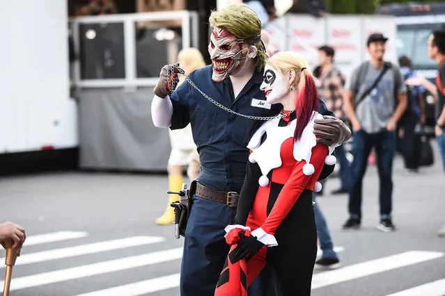 Comic Con attendees pose as Harley Quinn and the Joker during 2016 New York Comic Con – Day 1 on October 6, 2016 in New York City. (Photo by Daniel Zuchnik/Getty Images)