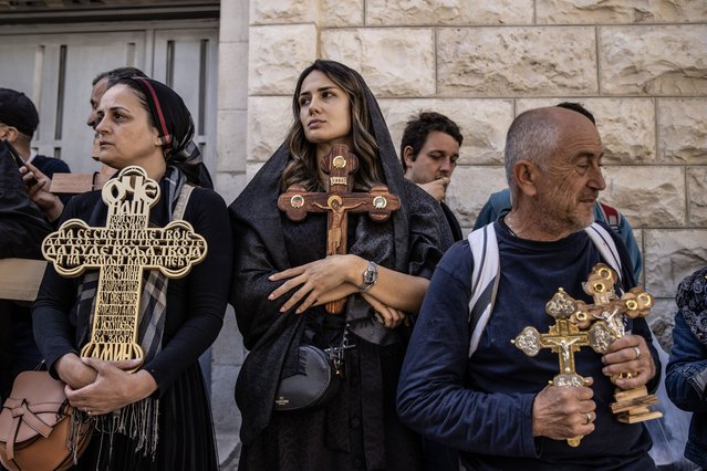 Christians coming from around the world carrying wooden crosses march along the Via Dolorosa (Way of Suffering) before Easter in Jerusalem's Old City during the Good Friday procession on May 03, 2024. (Photo by Mostafa Alkharouf/Anadolu via Getty Images)