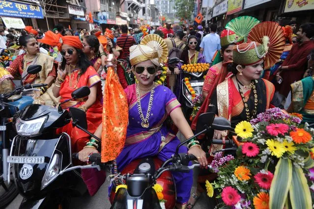 Women wearing traditional attire attend celebrations to mark the Gudi Padwa festival, the beginning of the New Year for Maharashtrians, in Mumbai, India on March 22, 2023. (Photo by Niharika Kulkarni/Reuters)