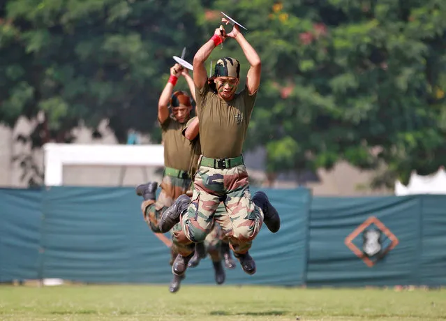 Indian army soldiers perform during a two-day long “Know Your Army” exhibition to attract more youths into the army, in Ahmedabad, India, October 17, 2016. (Photo by Amit Dave/Reuters)