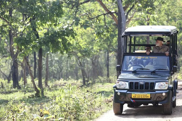 In this handout photo released by Press Information Bureau of India, Indian Prime Minister Narendra Modi rides in a jeep during his visit to Bandipur Tiger Reserve, in southern state of Karnataka, India, Sunday, April 9, 2023. (Photo by Press Information Bureau via AP Photo)