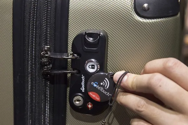 An eGeeTouch smart luggage lock is displayed during the 2015 International Consumer Electronics Show (CES) in Las Vegas, Nevada January 4, 2015. The TSA-approved locks can be unlocked with pre-paired NFC tag (shown) or by using an App on an Android smart phone. (Photo by Steve Marcus/Reuters)