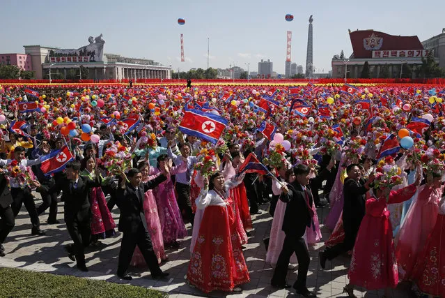 Participants march during a parade for the 70th anniversary of North Korea's founding day in Pyongyang, North Korea, Sunday, September 9, 2018. North Korea staged a major military parade, huge rallies and will revive its iconic mass games on Sunday to mark its 70th anniversary as a nation. (Photo by Kin Cheung/AP Photo)