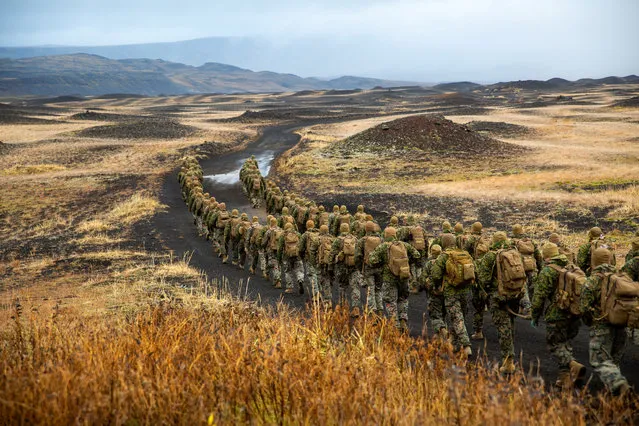 U.S. Marines with the 24th Marine Expeditionary Unit, deployed during Exercise Trident Juncture 18, hike to a cold-weather training site inland in Iceland, October 19, 2018. (Photo by Lance Cpl. Menelik Collins/U.S. Marine Corps/Handout via Reuters)