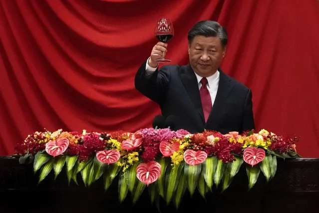 Chinese President Xi Jinping makes a toast after delivering his speech at a dinner marking the 74th anniversary of the founding of the People's Republic of China at the Great Hall of the People in Beijing, Thursday, September 28, 2023. (Photo by Andy Wong/AP Photo)