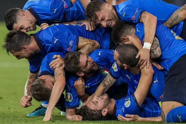 Italian players celebrate their second goal during the Euro 2020 soccer championship group A match between Italy and Switzerland at the Olympic stadium in Rome, Italy, Wednesday, June 16, 2021. (Photo by Alessandra Tarantino/Pool via AP Photo)