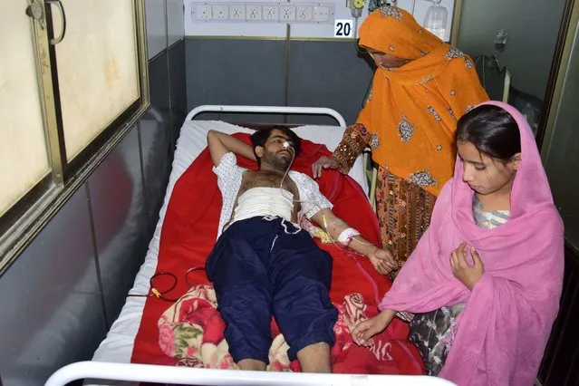An injured victim of Friday's deadly bombing is treated at a hospital in Quetta, Pakistan, Saturday, September 30, 2023. A suspected suicide bomber blew himself up among a crowd of people celebrating the Prophet Muhammad's birthday in southwestern Pakistan on Friday, killing more then 50 people and wounding dozens others, authorities said, in one of the country's deadliest attacks targeting civilians in months. (Photo by Arshad Butt/AP Photo)