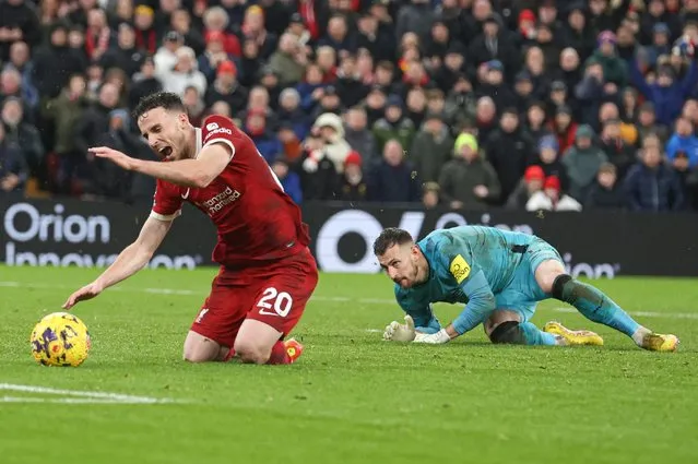Diogo Jota of Liverpool is fouled by Martin Dubravka of Newcastle United for a penalty during the Premier League match between Liverpool FC and Newcastle United at Anfield on January 01, 2024 in Liverpool, England. (Photo by Paul Currie/Colorsport/Rex Features/Shutterstock)