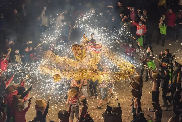 People perform a fire dragon dance at Debao County on November 30, 2022 in Baise, Guangxi Zhuang Autonomous Region of China. (Photo by VCG/VCG via Getty Images)