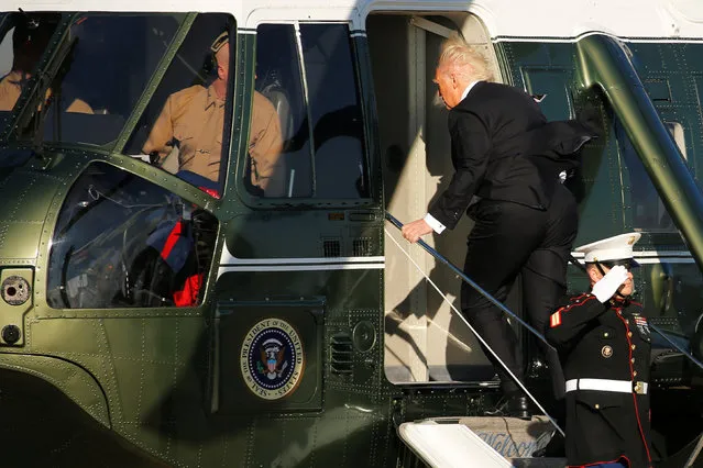 U.S. President Donald Trump boards the Marine One helicopter after arriving aboard Air Force One at Joint Base Andrews, Maryland, U.S. January 26, 2017. (Photo by Jonathan Ernst/Reuters)