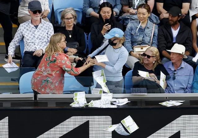 Two women scuffle as one of them (R) throws papers that read “Free Palestine” during the men's fourth round match between Alexander Zverev of Germany and Cameron Norrie of Britain at the Australian Open tennis tournament in Melbourne, Australia, 22 January 2024. (Photo by Mast Irham/EPA)