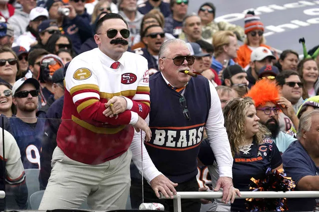 A San Francisco 49ers fan and a Chicago Bears fan dress as Bears' legend Mike Ditka during the first half of an NFL football game between the Bears and the 49ers Sunday, October 31, 2021, in Chicago. (Photo by Nam Y. Huh/AP Photo)