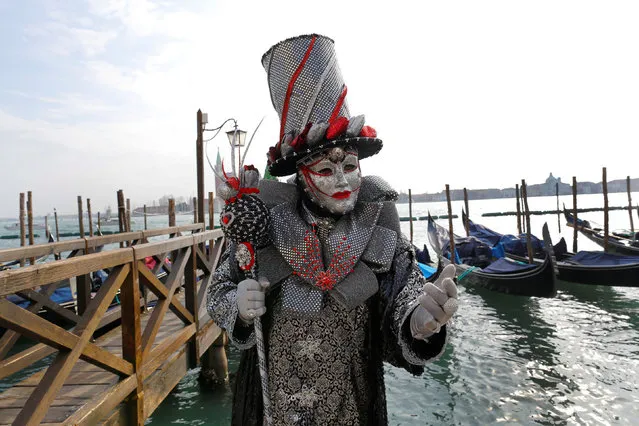 A masked reveller poses during the Venice Carnival in Venice, Italy February 12, 2017. (Photo by Tony Gentile/Reuters)