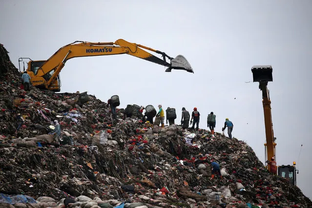 A group of scavengers search for items and plastics to sell for recycling at Bantar Gebang landfill in Bekasi, West Java province, Indonesia, March 2, 2019. (Photo by Willy Kurniawan/Reuters)