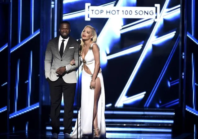 50 Cent, left, and Rita Ora present the award for top hot 100 song at the Billboard Music Awards at the MGM Grand Garden Arena on Sunday, May 17, 2015, in Las Vegas. (Photo by Chris Pizzello/Invision/AP Photo)