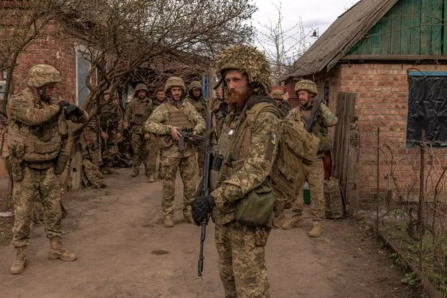 Ukrainian infantry soldiers of the 23rd Mechanized Brigade wait to head toward the frontline in the Avdiivka direction, in the Donetsk region, on April 3, 2024, amid the Russian invasion of Ukraine. (Photo by Roman Pilipey/AFP Photo)