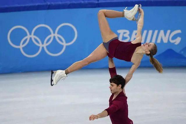 Minerva Fabienne Hase and Nolan Seegert, of Germany, compete in the pairs short program during the figure skating competition at the 2022 Winter Olympics, Friday, February 18, 2022, in Beijing. (Photo by David J. Phillip/AP Photo)